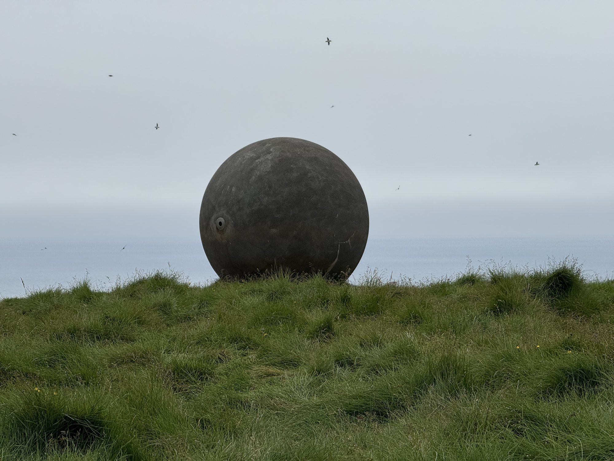 Standing at the Orbis et Globus Arctic Circle marker, Grímsey Island