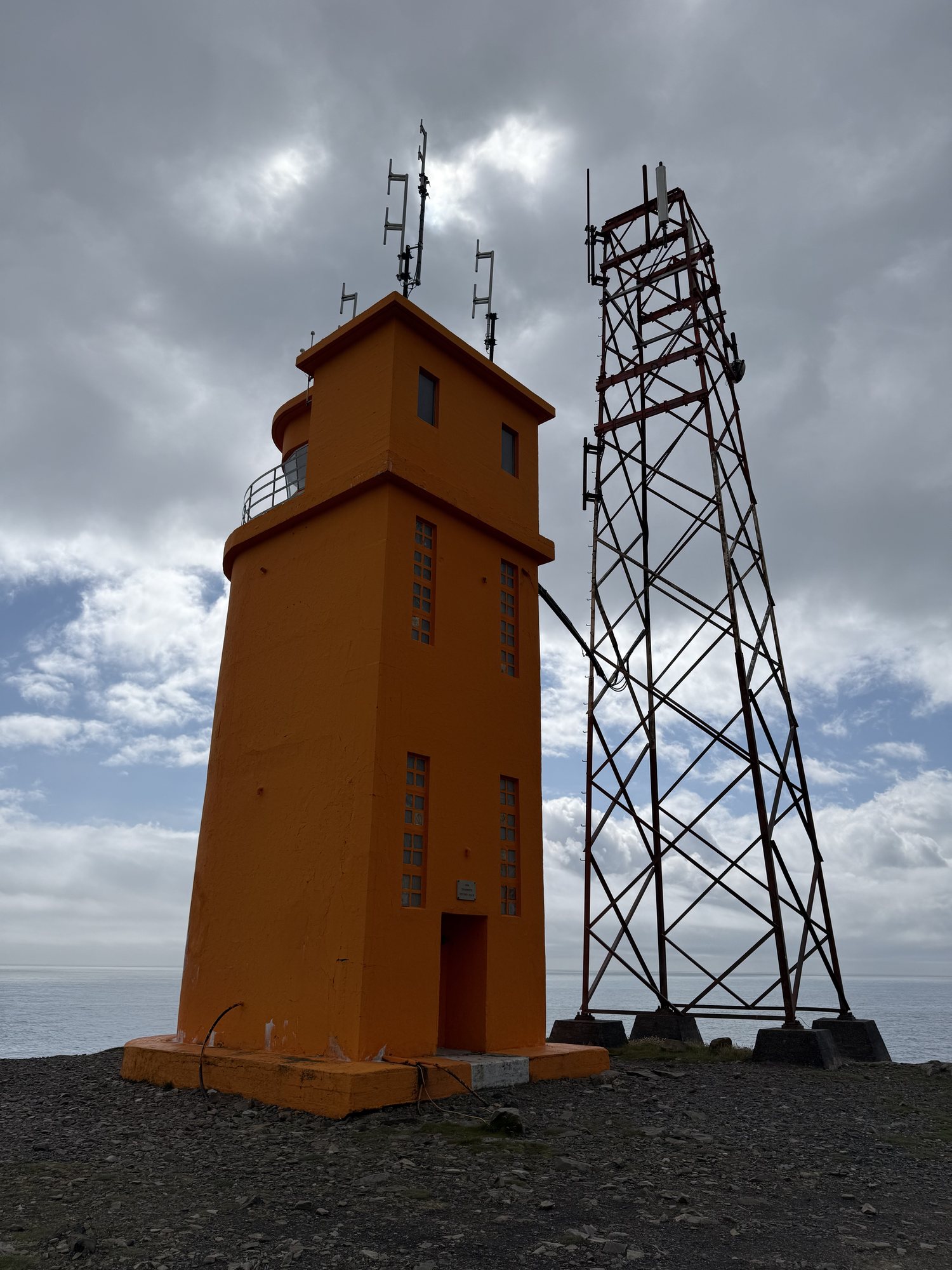 The orange Hvalnes Lighthouse, eastern Iceland