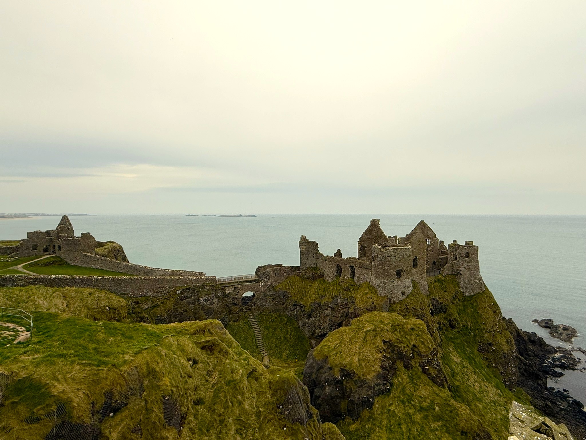 The clifftop ruins of Dunluce Castle above the sea, County Antrim