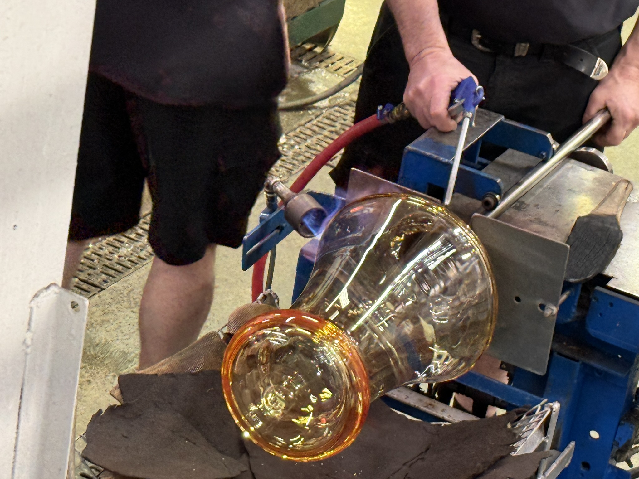 A craftsman blowing glass at Waterford Crystal